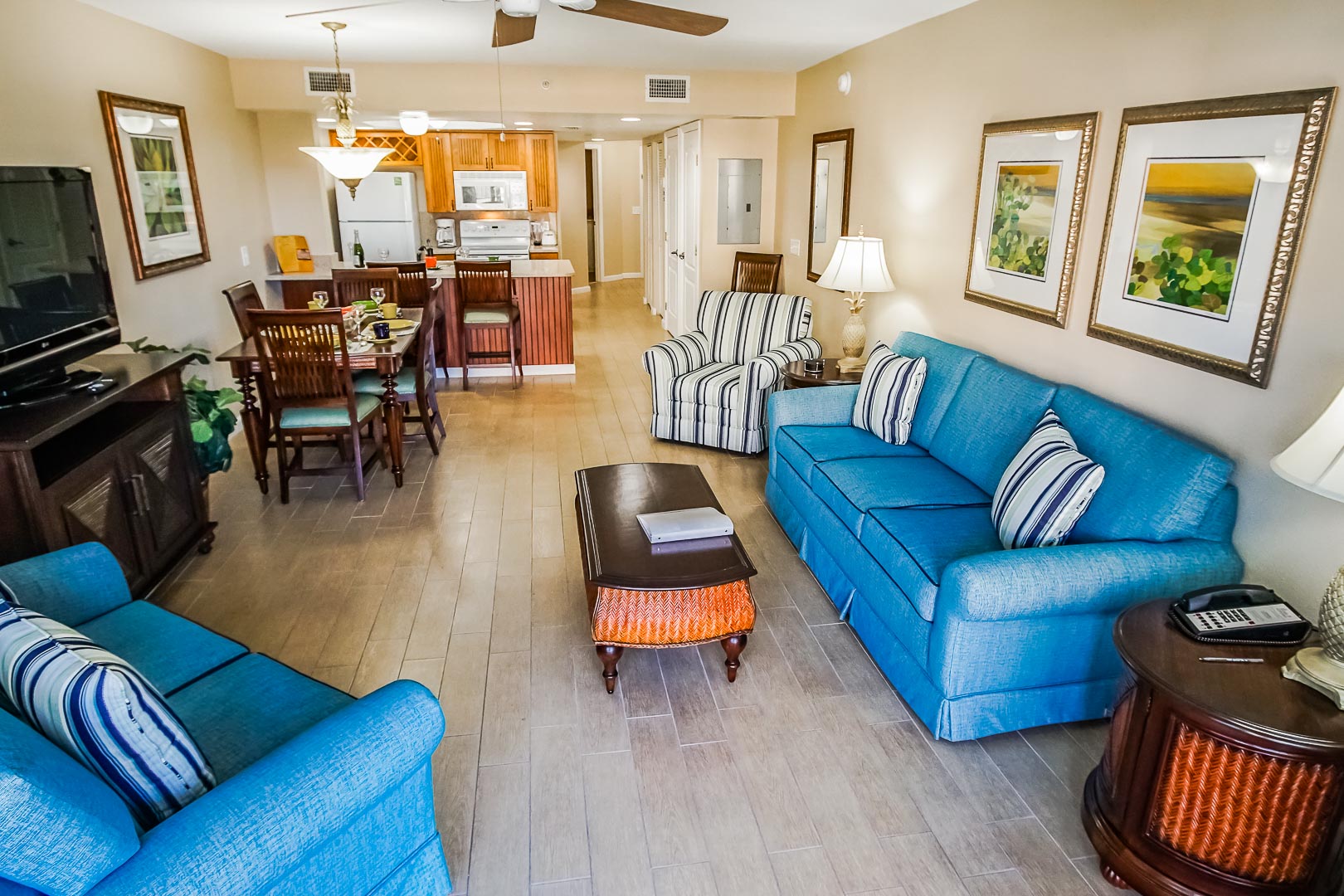 A spacious living room and dining area at VRI's The Resort on Cocoa Beach in Florida.